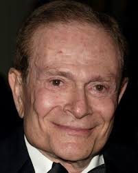 Gary Beach posing with the painting Photo (2005-04-01 16:16:24)