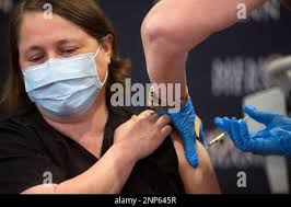 Dr. Linda Yancey, infectious disease specialist, receives a dose of the  Pfizer-BioNTech vaccine for COVID-19 from Mindy Warren Tuesday, Dec. 15,  2020 in Houston. A group of front line medical workers at