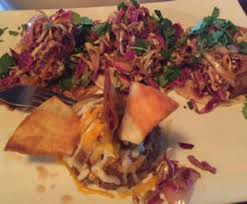 You can either eat the beans on the side or use it as a taco topping. Fish Tacos Served With Refried Beans Cheese And Chips Picture Of Itty Bitty Bar Holland Tripadvisor