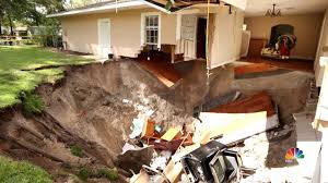 dozens of sinkholes appear across