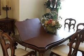 A rectangular tempered glass tabletop is supported. Dining Room Table Protector Pads Waterproof Heat Resistance Tpc