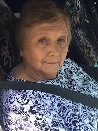Can anyone remove the seatbelt please? I would love to use this picture of  my grandmother at her memorial! Thank you in advance