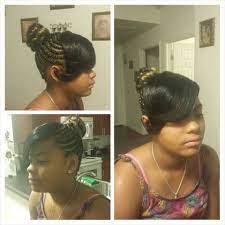 Side bangs and wavy hair bring definition to the overall look. Cornrows Into Bun With Bangs Sewn Cool Hairstyles Curly Hair Styles Natural Hair Styles