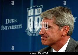 ** FILE ** Duke Athletic Director Joe Alleva pauses during a news  conference in this March 28, 2006 file photo in Durham, N.C. Alleva set an  optimistic tone Wednesday, Aug. 16, 2006 as he looked toward the lacrosse  program's fresh start under new coach ...