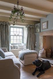 Traditional country living room with window seat, antique carpet, wood dresser and antiques. 25 Beautiful Homes Cosy Home Decor Cottage Living Rooms French Country Living Room