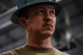 U.S. Air Force Airmen from the 1st Special Operations Maintenance Squadron  Aerospace Ground Equipment, replace a defective high-volume compressor in a  self generating nitrogen servicervicing cart at Hurlburt Field, Florida,  Jan. 31,