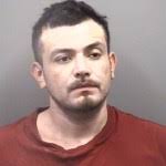 One charged after officer witnesses drug deal while refueling at gas  station