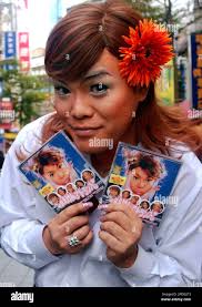Famed Japanese singer Ken Maeda holds copies of his new trance-style music  recording "Koi No Buchaiage Tengoku" during a media event, Wednesday, Dec.  28, 2005, in Taipei, Taiwan. (AP Photo/Chiang Ying-ying Stock