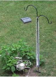 Slide the end of the shepherd's hook through the length of the pvc pipe. Diy Squirrel Proof Bird Feeder Slinky Google Search Bird Feeder Poles Squirrel Proof Bird Feeders Diy Bird Feeder
