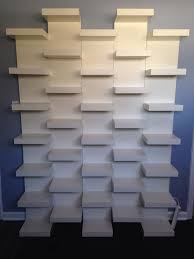 Wall Of Book Shelves Ikea Lack Book Shelves Mounted Together In A Staggered Pattern To Create Built In Boo Bookshelves Diy White Wall Shelves Wall Shelf Unit