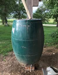 Rain barrels collecting rain water to be used when it is needed. Rain Barrels Unl Water