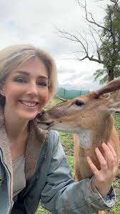 friendly deer at neighbor's farm befriends chicken owner