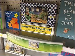 Little nanette has a big job. Nanette S Baguette Book Shelf Edge Dimensional Fixtures Close Up