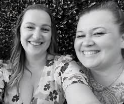 Could someone please edit this photo for me. It's a photo of my Mom. Would  it be possible to erase my brother & sister in law who are in the photo  behind