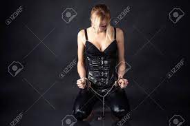 Obedient Slave Woman In Handcuffs Stock Photo, Picture and Royalty Free  Image. Image 26117623.