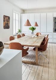 Bright Dining Room Featuring A Large Wooden Plank Table Brown Leather Dining Chairs And Pendants I Wood Dining Room Table Bright Dining Rooms Wood Dining Room
