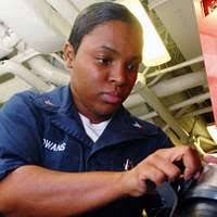 Former POW and U.S. Air Force COL Fred Vann Cherry (Captured 22 Oct 65)  waves to the public and press there to greet the plane load of former POWs  flown in from
