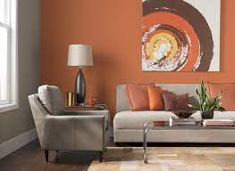 An ivory carpet and couch taupe tables and walls and purple accessories. Orange Paint Ideas For Living Room Burnt Color Colors Delectable Layjao