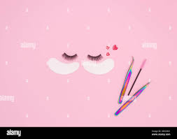 Tools and patches for eyelash extensions and artificial eyelashes on a pink  background. Tools for the lashmaker. The view from the top Stock Photo -  Alamy