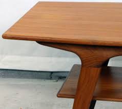 4 angled struts elegantly support the legs on the underside of the table. 1950 S Danish Modern Teak Coffee Table Modernism