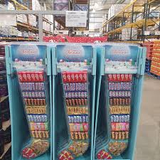 Christmas, large red mesh filled baby boomers christmas stocking, novelty toys, blue hair girl troll, super ball, trading cards, embrace123. Costco Is Selling A Giant Stocking Filled With 105 Chocolate Bars And Sweets Including Kitkat And Snickers