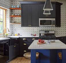 The kitchen features white cabinets, black countertops, black hardware, matte. Kitchens With Black Cabinets