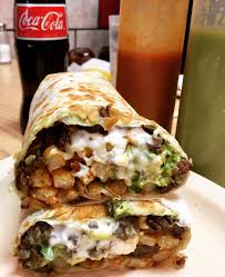 The California Burrito This Delicious And Mythical Burrito Is Filled With Carne Asada Cheese Guacamole Sour Cream An Mexican Food Recipes Food Recipies Recipes