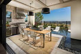 The garage door makes for easy indoor/outdoor access. The Serrano Luxury Outdoor Living Space Modern Outdoor Kitchen Outdoor Living Design Outdoor Living Rooms