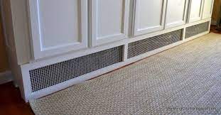 My solution was to elevate them above the heaters, using legs. Float Cabinet Over Baseboard Heater Baseboard Heating Baseboard Heater Baseboard Heater Covers