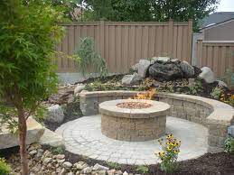 Great Circular Paver Patio Kit With Large Round Outdoor Fire Pit And Do It Yourself Retaining Wall From Natur Fire Pit Landscaping Backyard Fire Backyard Patio