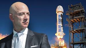 His hair is bald and his eye color is brown. Blue Origin S New Shephard Set To Take Jeff Bezos And Brother To Space