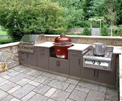 This Compact Outdoor Kitchen Layout Covers The Bases With A Grill Smoker And Side Burner Outdoor Kitchen Countertops Outdoor Kitchen Cabinets Outdoor Kitchen