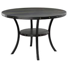 A deep espresso finish and antique gold nail heads give this piece a worldly appeal. New Classic Crispin Transitional Round Dining Table With Nailhead Trim Wilcox Furniture Dining Tables