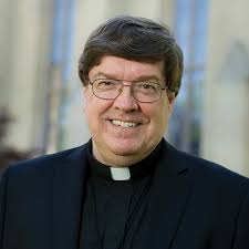 Rev. James Foster, CSC, MD