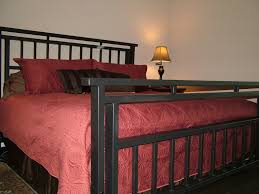Dress up the master bedroom or a guest room with a luxurious and sophisticated iron canopy bed for a twin, queen, or king size mattress. Bedroom Black Wrought Iron Bed Frames Present Eternal Sets Atmosphere Ideas Decorating Furniture Antique Bedrooms Atrium Wall Decor With Beds Painting A Headboard Apppie Org