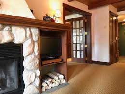 Tv on one wall and the. Living Room And Fireplace With French Doors Into The Bedroom Picture Of Post Hotel Spa Lake Louise Tripadvisor