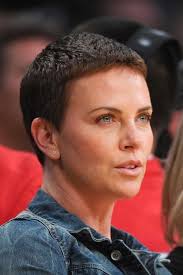 If there is one star who knows her way around a short hairstyle, it's charlize theron. Charlize Theron Super Short Dark Hair Short Hair Styles Pixie Super Short Hair Short Hair Styles