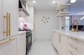 Modern white kitchen cabinets with gold handles. A Kitchen With White Shaker Cabinets And Gold Brass Hardware Contemporary Kitchen Vancouver By Dimora Interiors Houzz