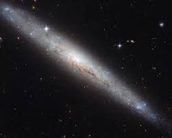 Also called arp 12, it's about 62,000 light years across, smaller than the milky way by a fair margin. Esa Hubble Portrays A Dusty Spiral Galaxy