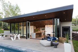White stucco veneer with light wood siding. Photo 1 Of 24 In Modern Mountain Pool House By Melissa Kelsey Dwell
