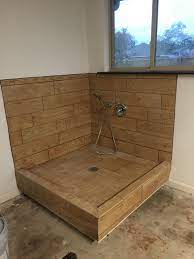 Raised Dog Washing Station With Wood Look Tile In Garage Nook 1970s Ranch Remodel Orohomes Dog Washing Station Garage To Living Space House Remodeling Plans