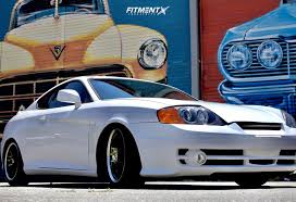 Maybe you would like to learn more about one of these? 2004 Hyundai Tiburon Gt With 17x7 5 Maxxim Knight And Bravuris 215x45 On Coilovers 1768869 Fitment Industries