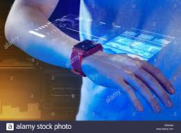 Close up of a smart watch and a holographic projection Stock Photo ...