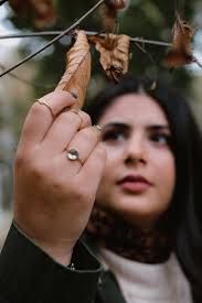 A Woman Touching a Twig · Free Stock Photo