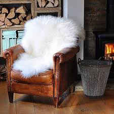 20 Unexpected Ways To Use Sheepskin Domino White Leather Chair Leather Chair Sheepskin Decor