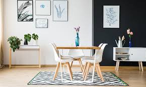 The addition of white wainscoting, a fun rug and rattan chairs keeps the space from becoming dreary and helps it feel fresh and modern. 10 Dining Room Decor Ideas Design Cafe