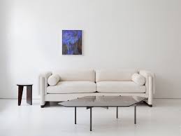 To keep your coffee table balanced, vary the scale of display items and stack or group like objects together. Lawson Coffee Table Radnor