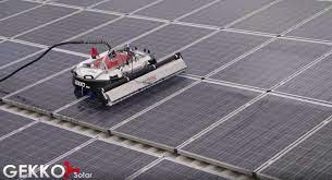 Soak a mop or sponge in the solar panel cleaning solution; Gekko Solar Robot