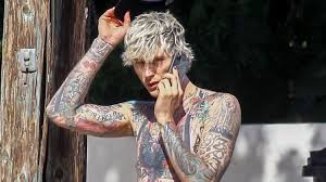 He also has a bold tattoo at the top of his head that looks to be in the shape of a diamond. Machine Gun Kelly Shows Off Fully Tattooed Torso While Shirtless Machine Gun Kelly Shirtless Just Jared