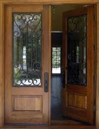 Puertas acorazadas de doble hoja fabricadas por gardesa con distintas posibilidades. Puerta De Calle Doble Un Tablero Y Reja Puertas Alberto Cano